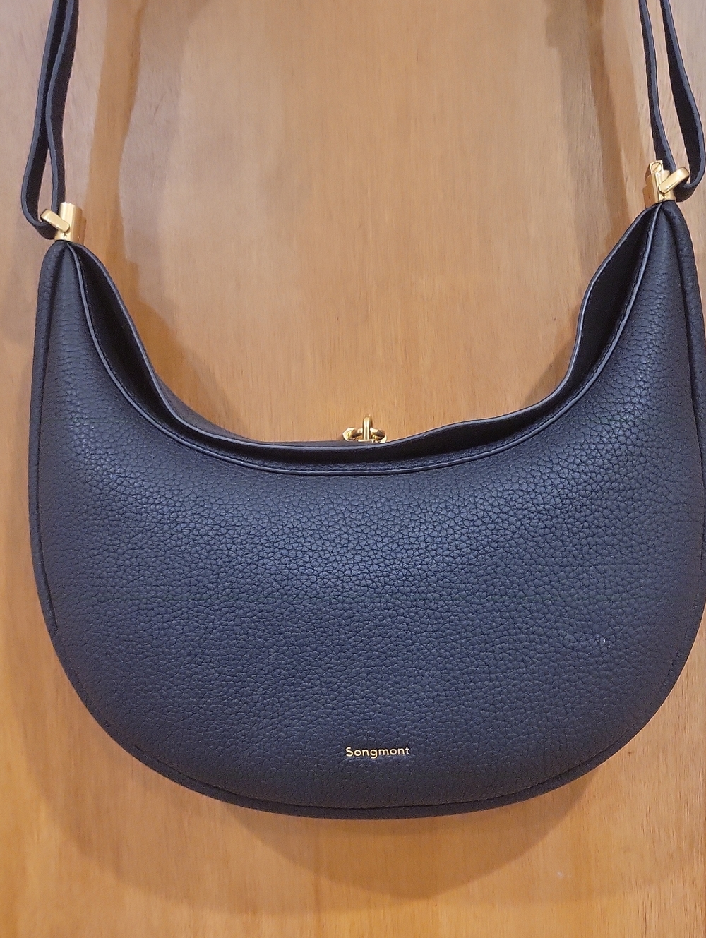 Songmont Black Pebbled Leather Crescent Shoulder Bag with Gold Hardware